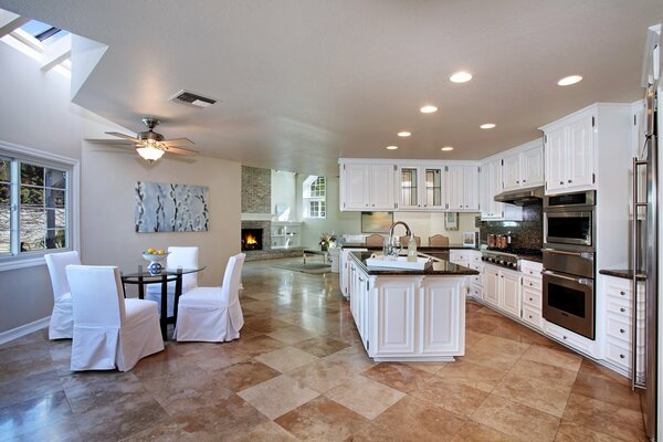 The interior of a modern kitchen in white tones