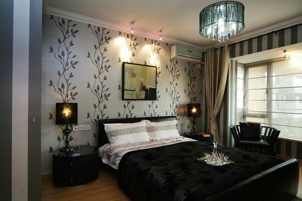 Stylish bedroom in dark colors with a large bed