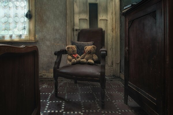 Antique armchair with teddy bears