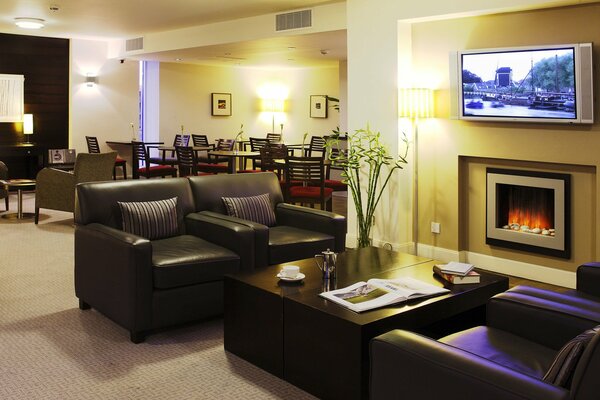 Beautiful interior with fireplace in the lobby of the hotel