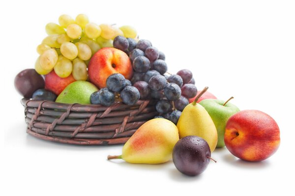 An edible fruit basket. sweet grapes and juicy pear