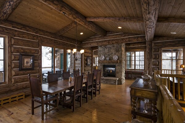 Living room with fireplace , stone and wood wood are used in the interior