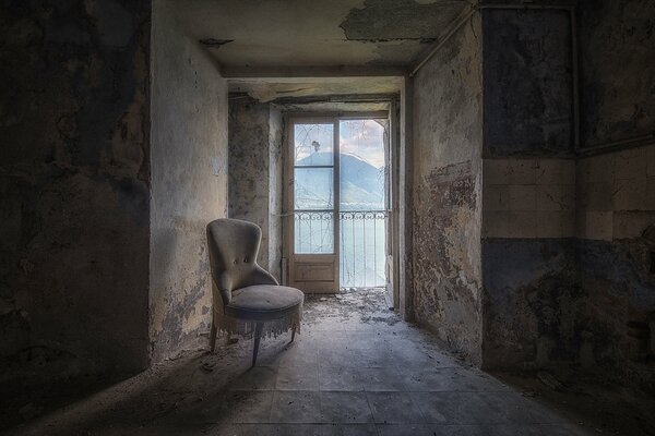 At the door to the balcony you can see an old worn chair