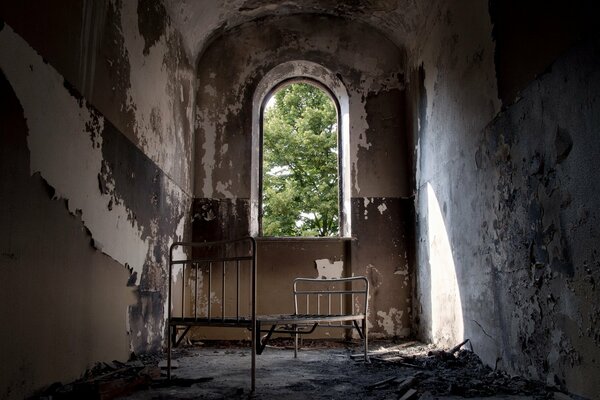 A cell in a monastery with a window in the tower