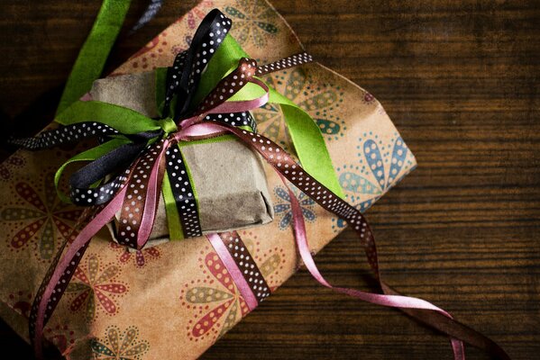 Beautiful gift wrapping in paper with ribbons