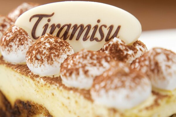 Macro photo of an appetizing tiramisu cake in shades of brown