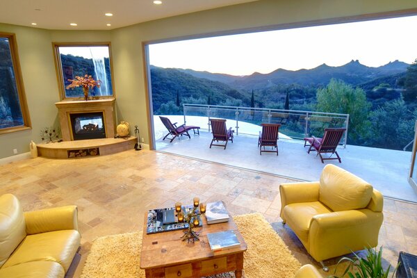 Living room with an open terrace and mountain view