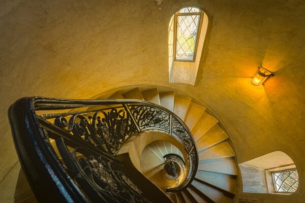 The staircase winds into a high tower