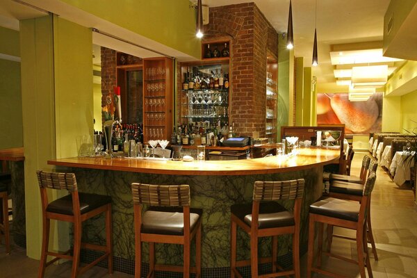 High bar counter in a restaurant with chairs