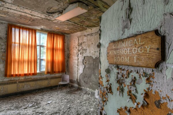 A room with unfinished repairs and a strange inscription on the door