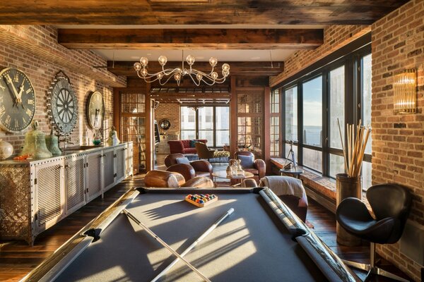 Playing billiards in the loft interior