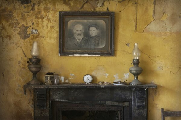 Portrait of two men over the fireplace