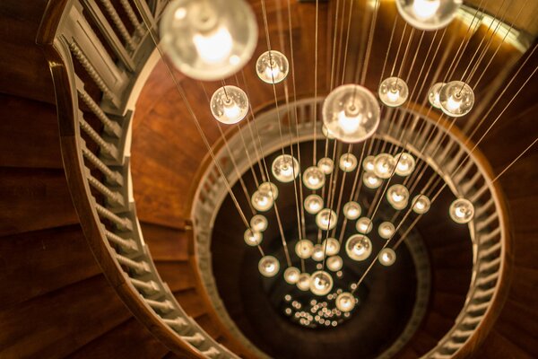 Spiral staircase with round light bulbs on threads