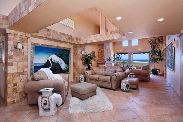 Large living room with paintings on the wall