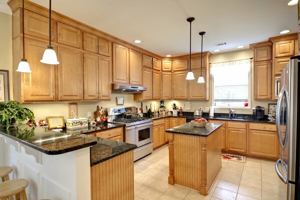 Kitchen interior under a tree with hanging lamps