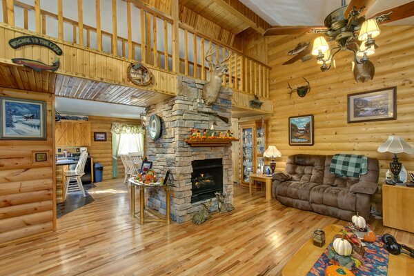 The interior of the living room. Fireplace and chandelier in contact