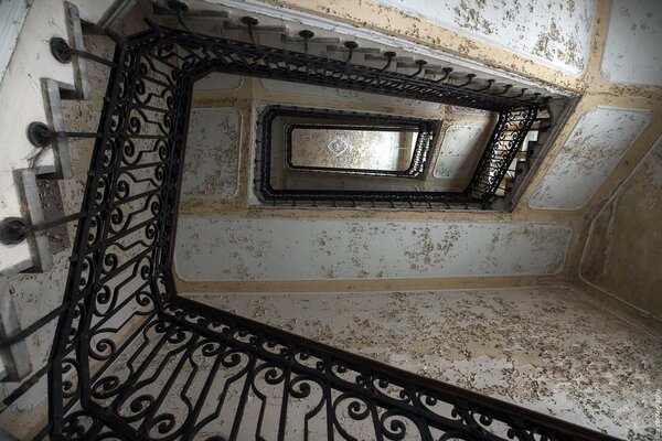 Staircase top view on the background of the walls