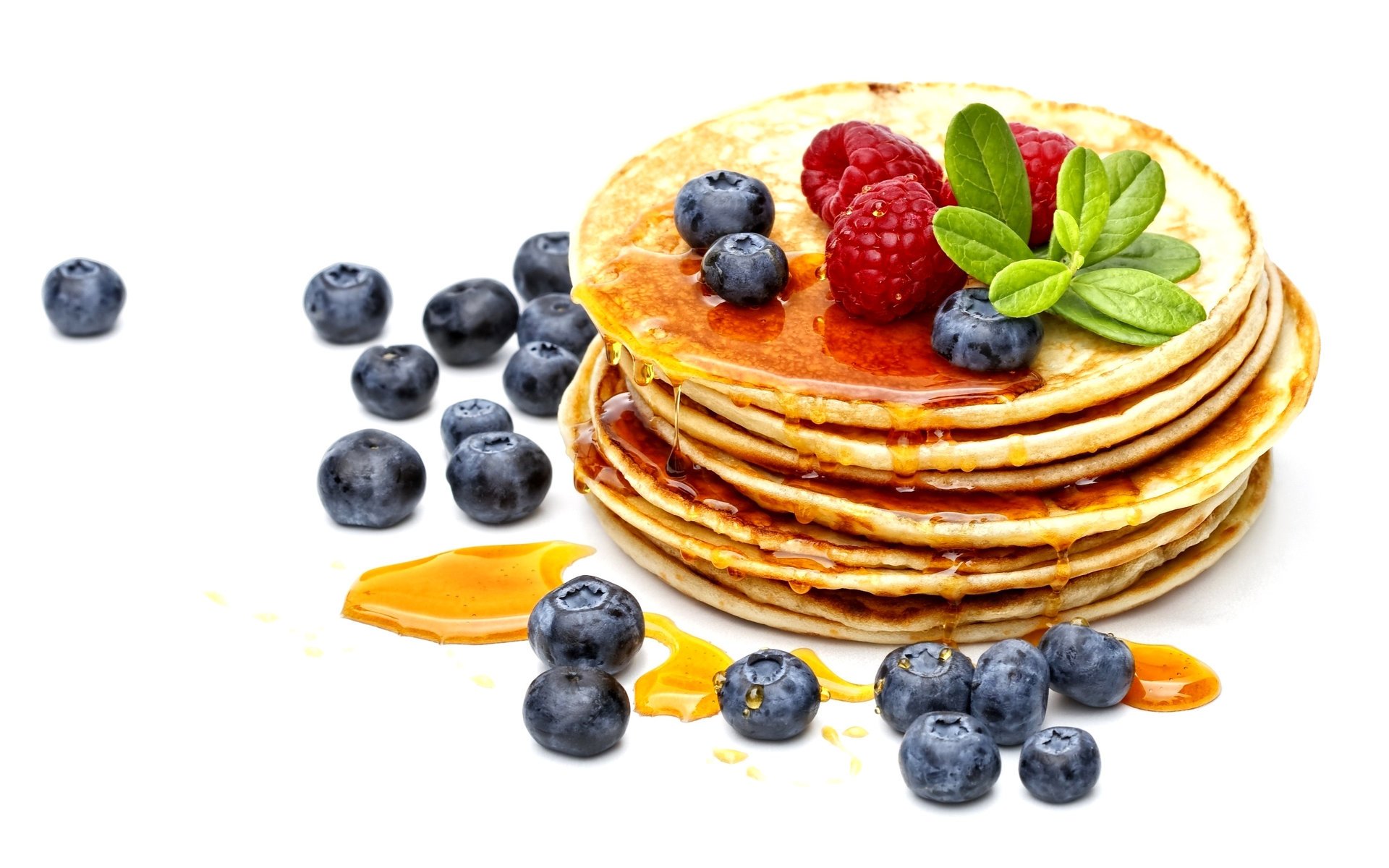 food pancakes pancakes fritters fruit sauce honey blueberries raspberries breakfast