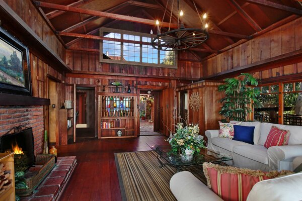 Living room with fireplace in semi-darkness in maximalism style