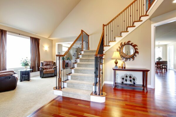 Stairs from the living room with a cozy staircase area