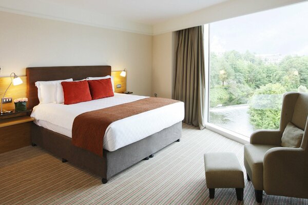 Bedroom with a large panoramic window