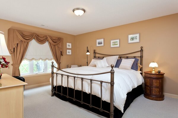 Cozy bedroom in the light of night lamps