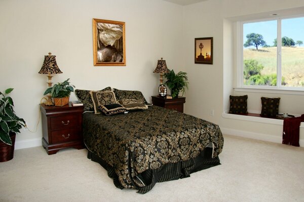 Beautiful bedroom interior with a picture on the wall