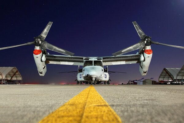 Plane at the airport against the night sky