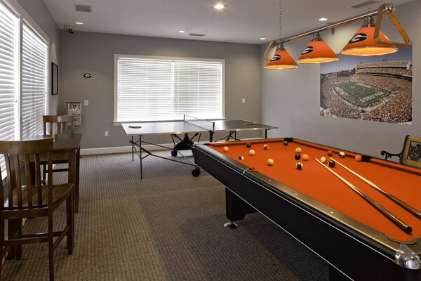 The room is gray with a billiard table