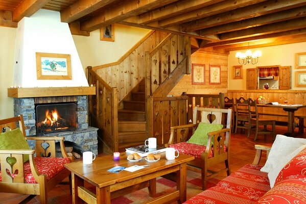 Photo design of the living room . Room interior, fireplace and wooden staircase