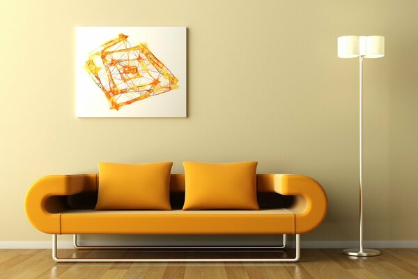 Orange abstraction over a minimalist sofa