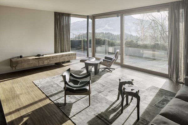 Living room in gray tones with panoramic windows