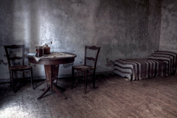 Old shabby furniture in a gray room