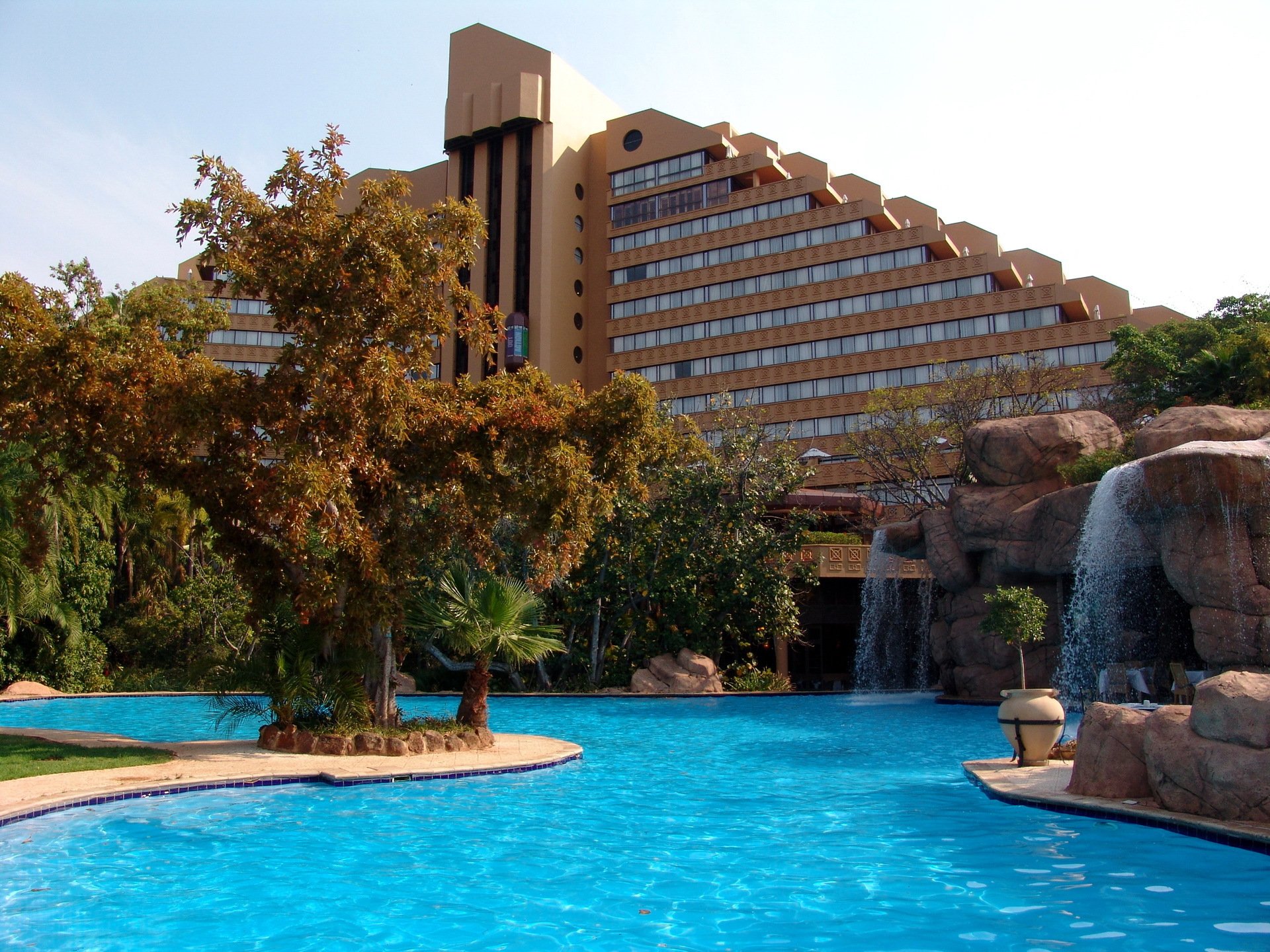 hotel sun city south africa design architecture pool stones waterfall palm trees