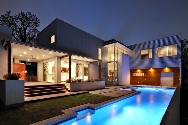 Exterior of a country house with a swimming pool