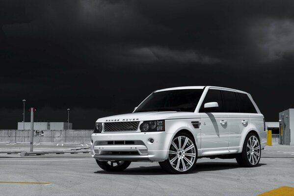 White jeep on a black sky background