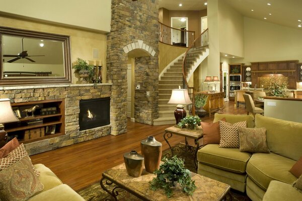 Rich interior of the living room with fireplace and mirror