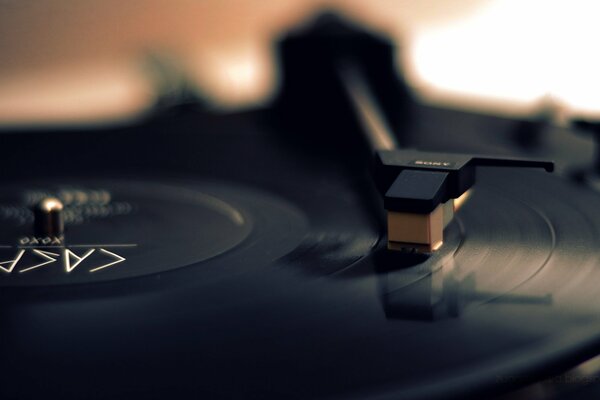 A vinyl record plays music