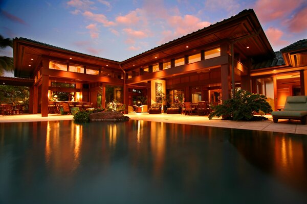 The water surface and a beautiful house in the evening