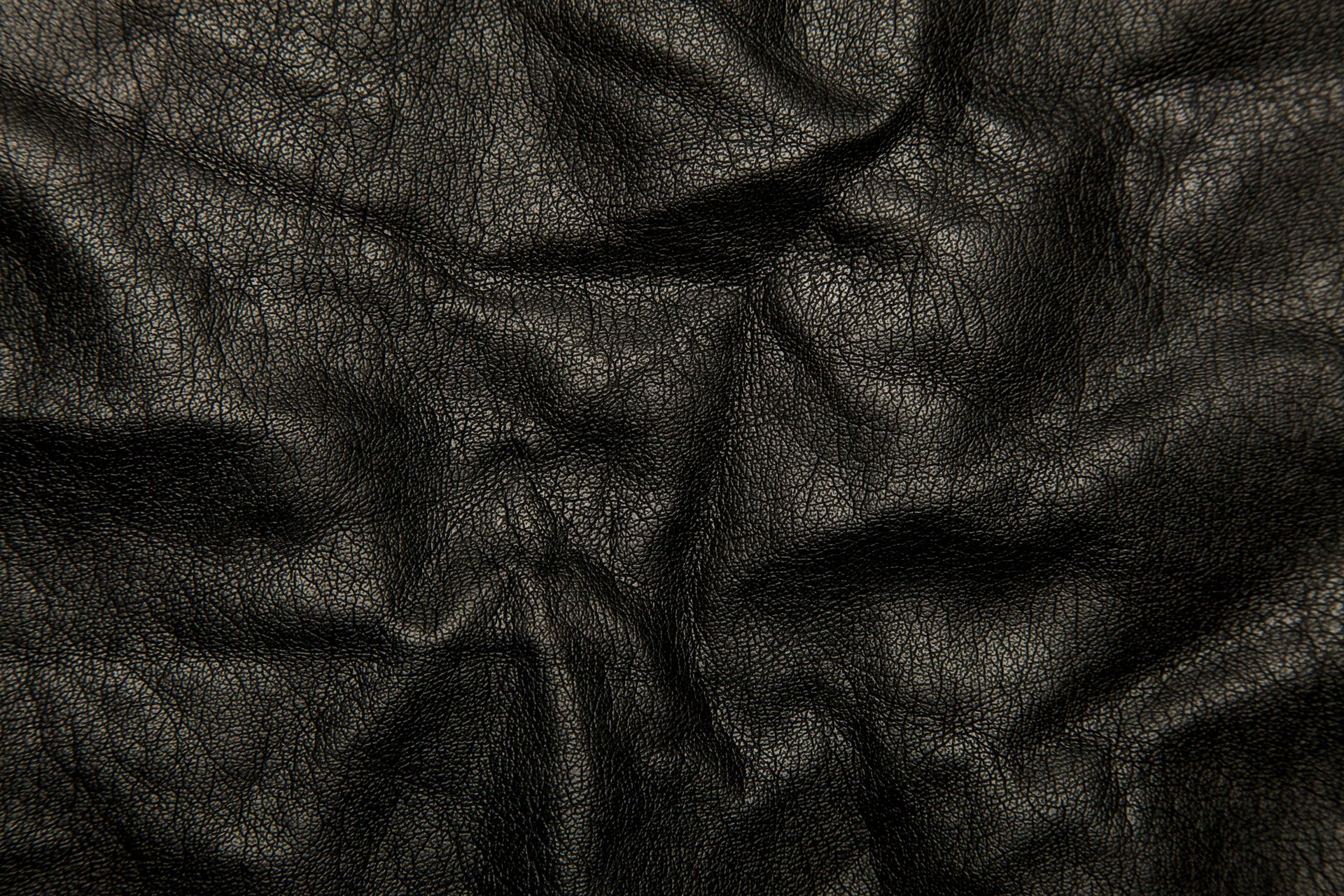 leather folds texture black background cracked