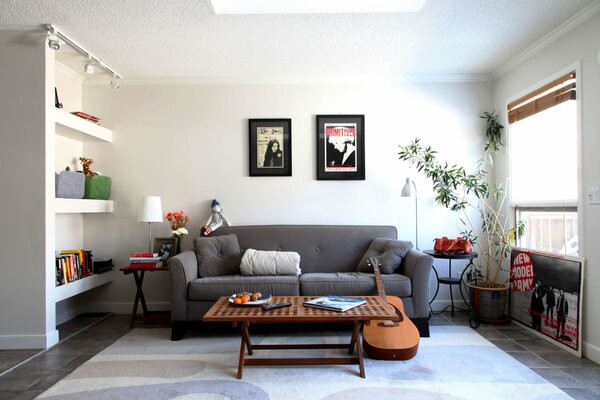 Bright cozy living room with a guitar