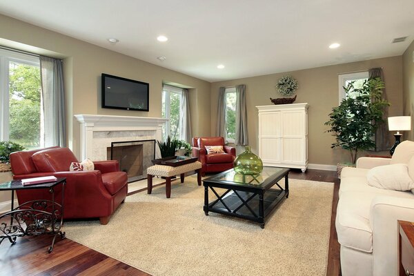 Spacious living room with white furniture and black tables