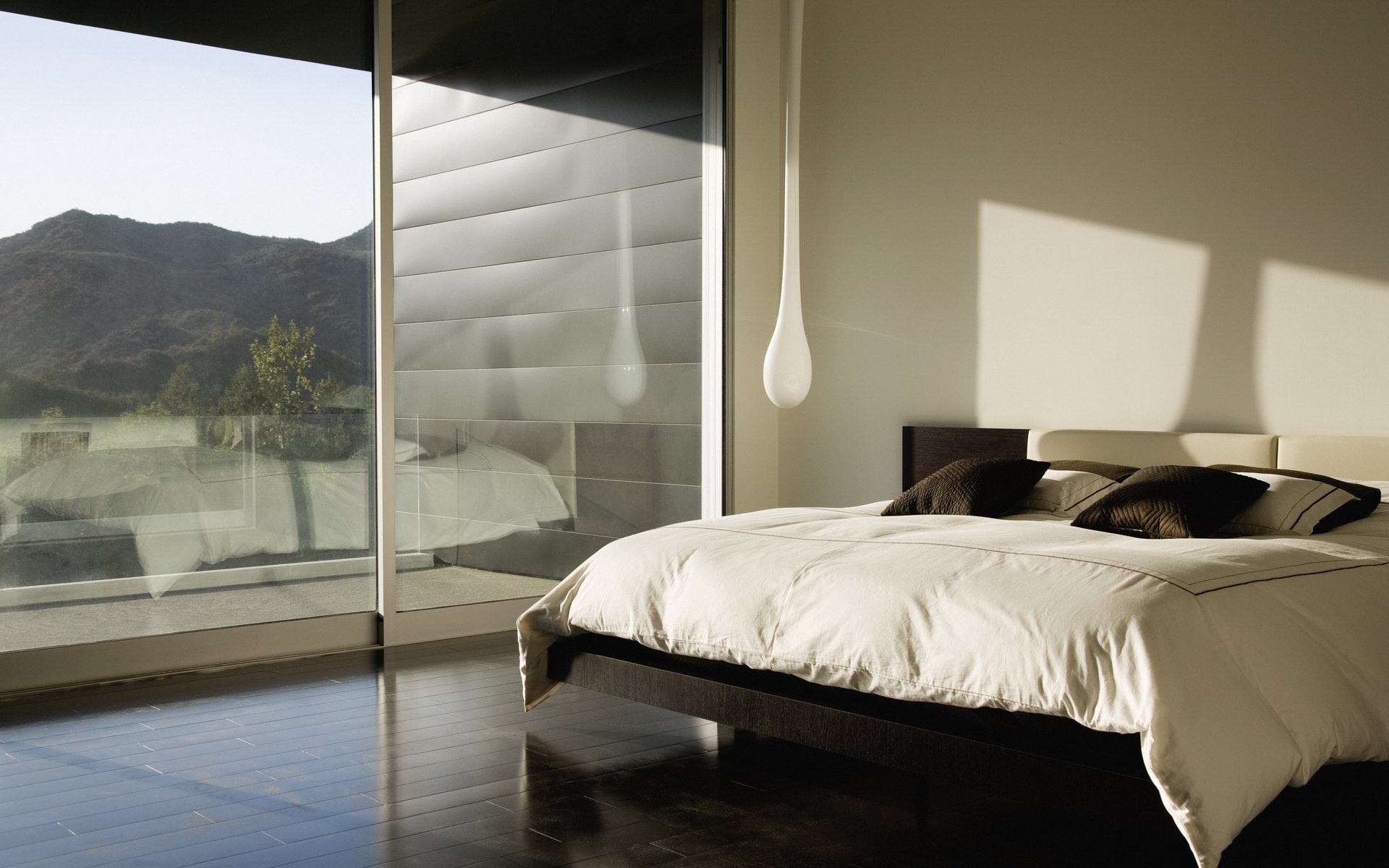 interior room design bed stupid lamp window pillow nice view outside the window mountain reflection shadow