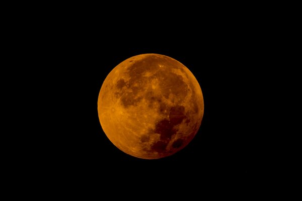 Planeta naranja en rectángulo negro