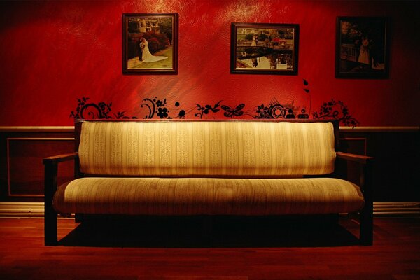 The image of a sofa on a red background