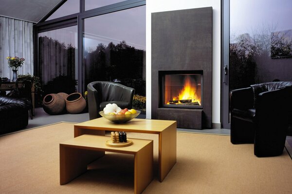 The interior of the living room. Fireplace and furniture