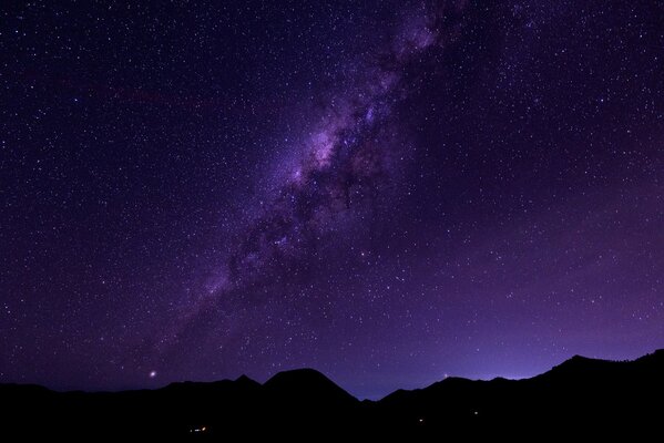 Mountains against the background of space and the Milky Way