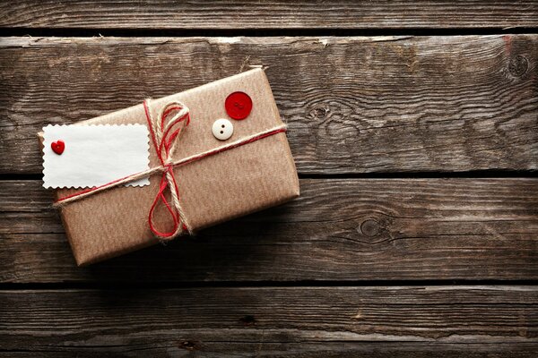 A package packed in kraft paper on a wooden table