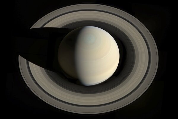 Planet Saturn with rings in gray