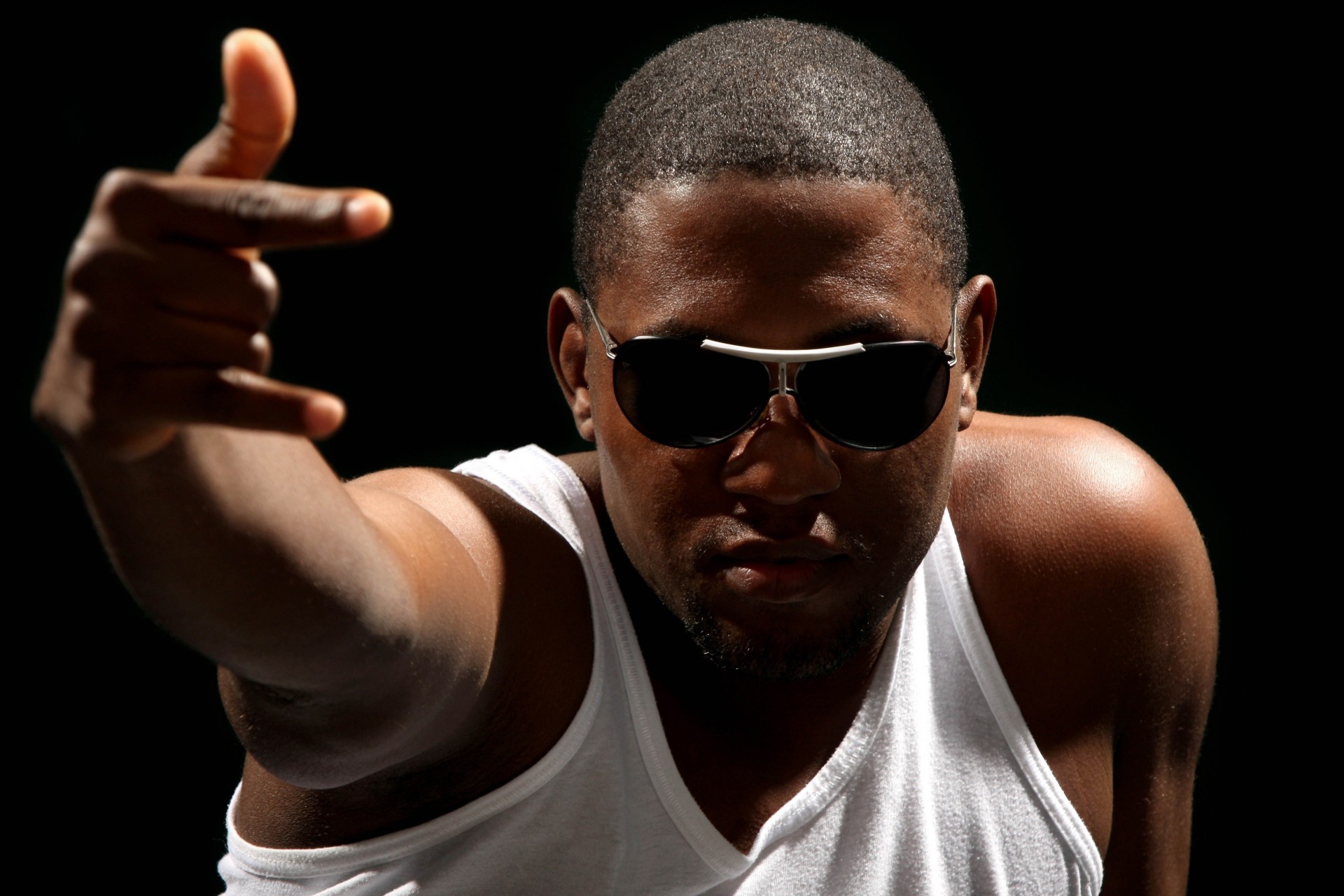 fingers hand black background sunglasses man